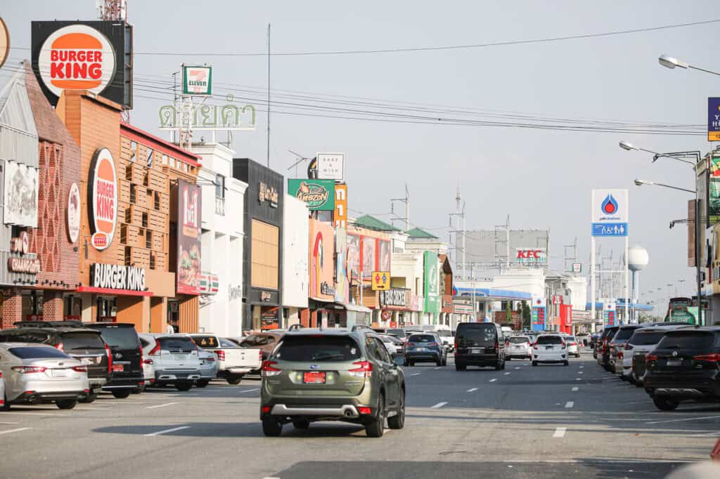 highway rest stop parking lot, roadside restaurant parking lot, cars parked at rest area