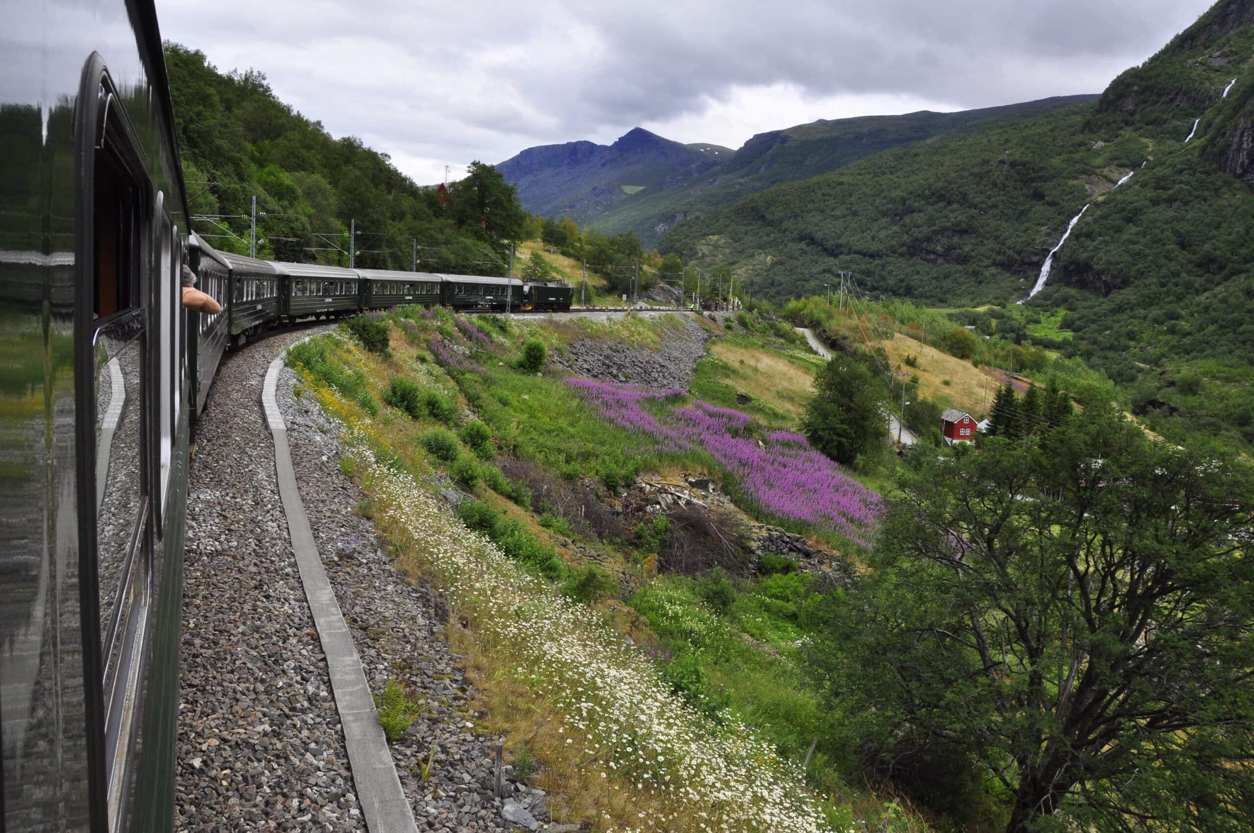 train fjord Norway waterfall