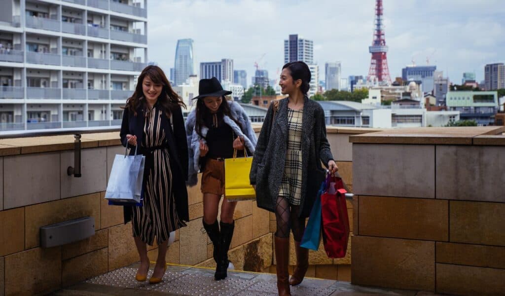 Group of japanese women spending time in Tokyo, making shopping in differents areas of the city