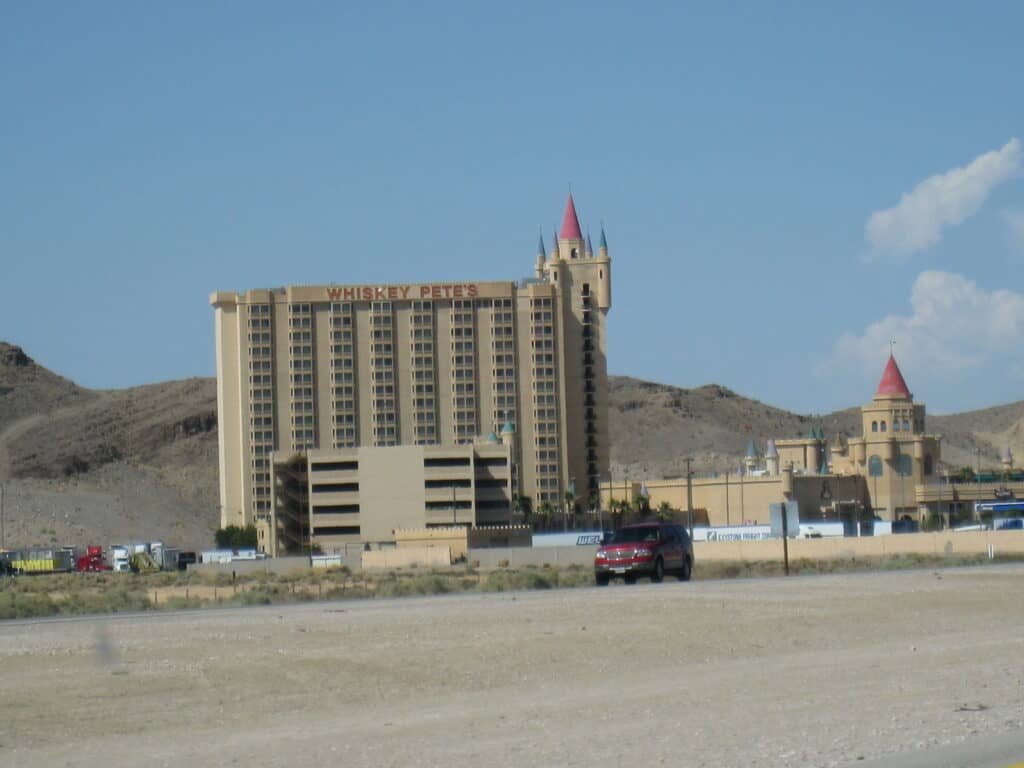 Vegas hotel with castle turrets and desert landscape in the background.