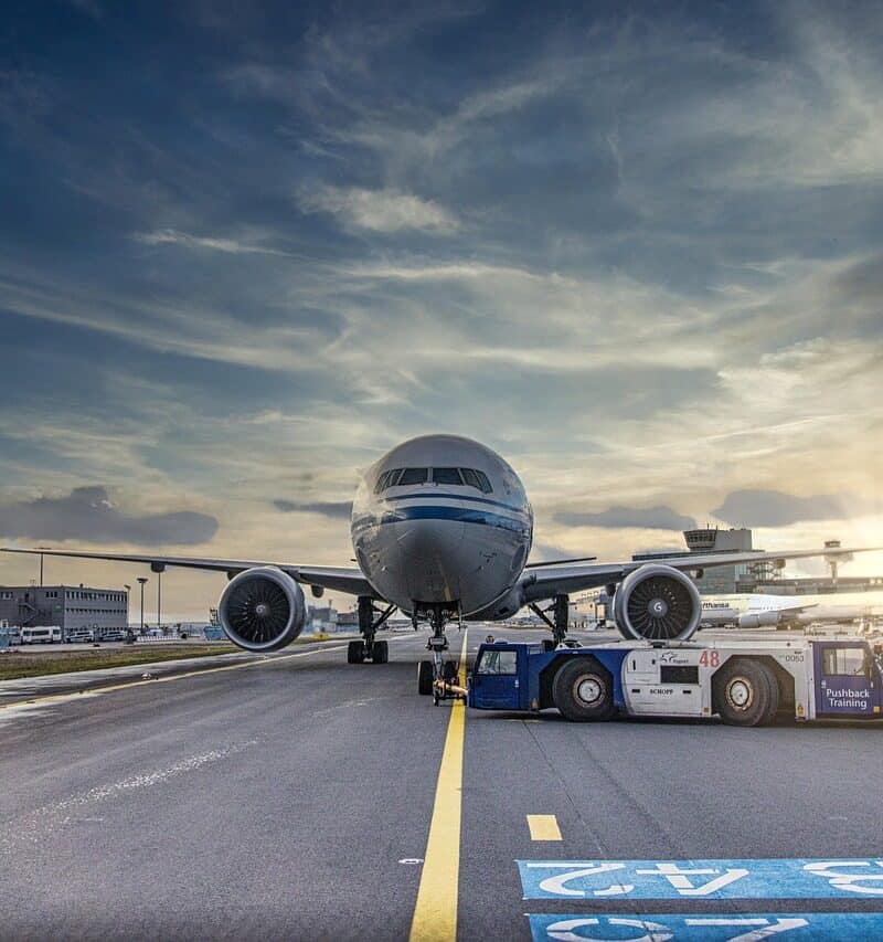 airplane taxiing runway sunset travel delay concept