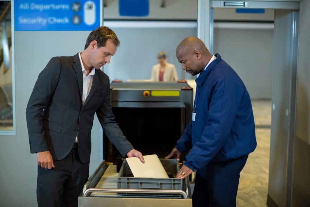 airport security officer evaluating documents
