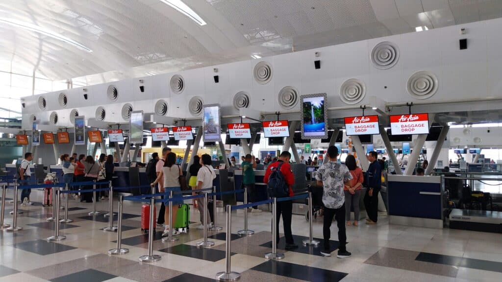 foreign traveler passport check airport line