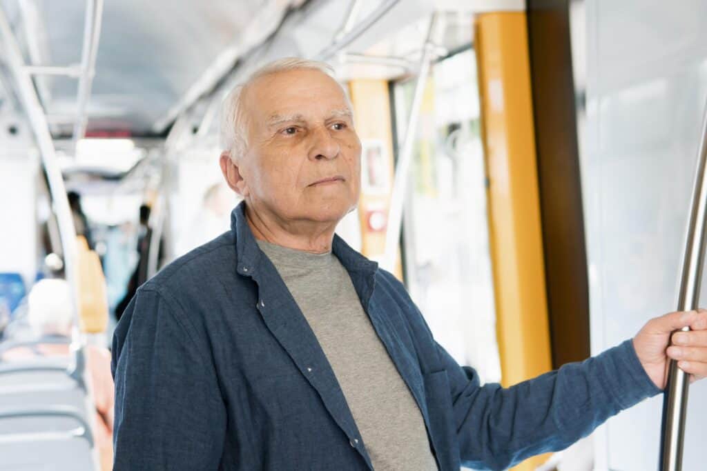 older man offered seat train