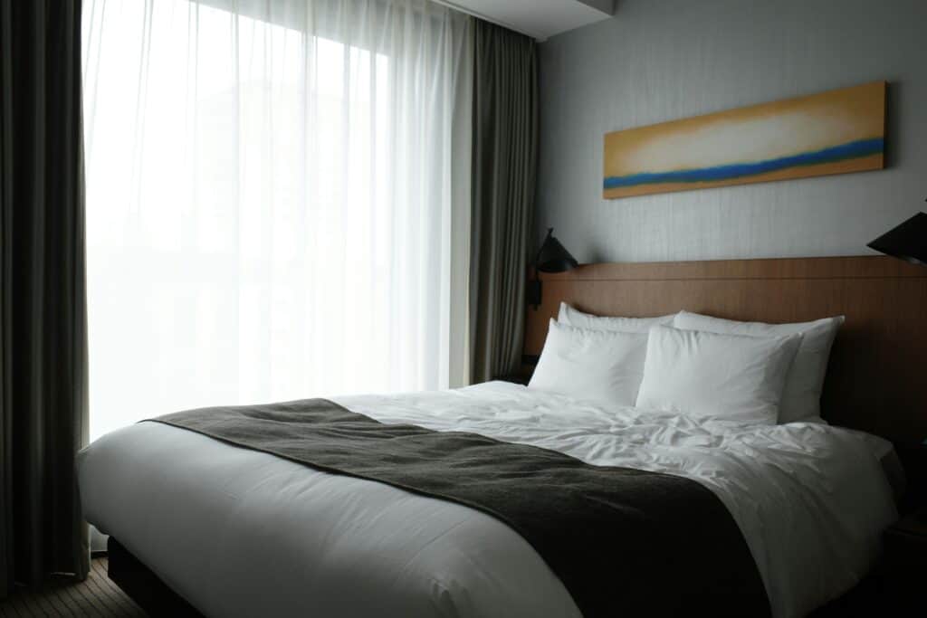 hotel bed with no visible outlets