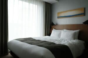 hotel bed with no visible outlets