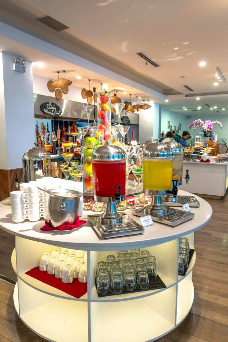 hotel breakfast buffet spreading trays cereal coffee juice hotel dining room”