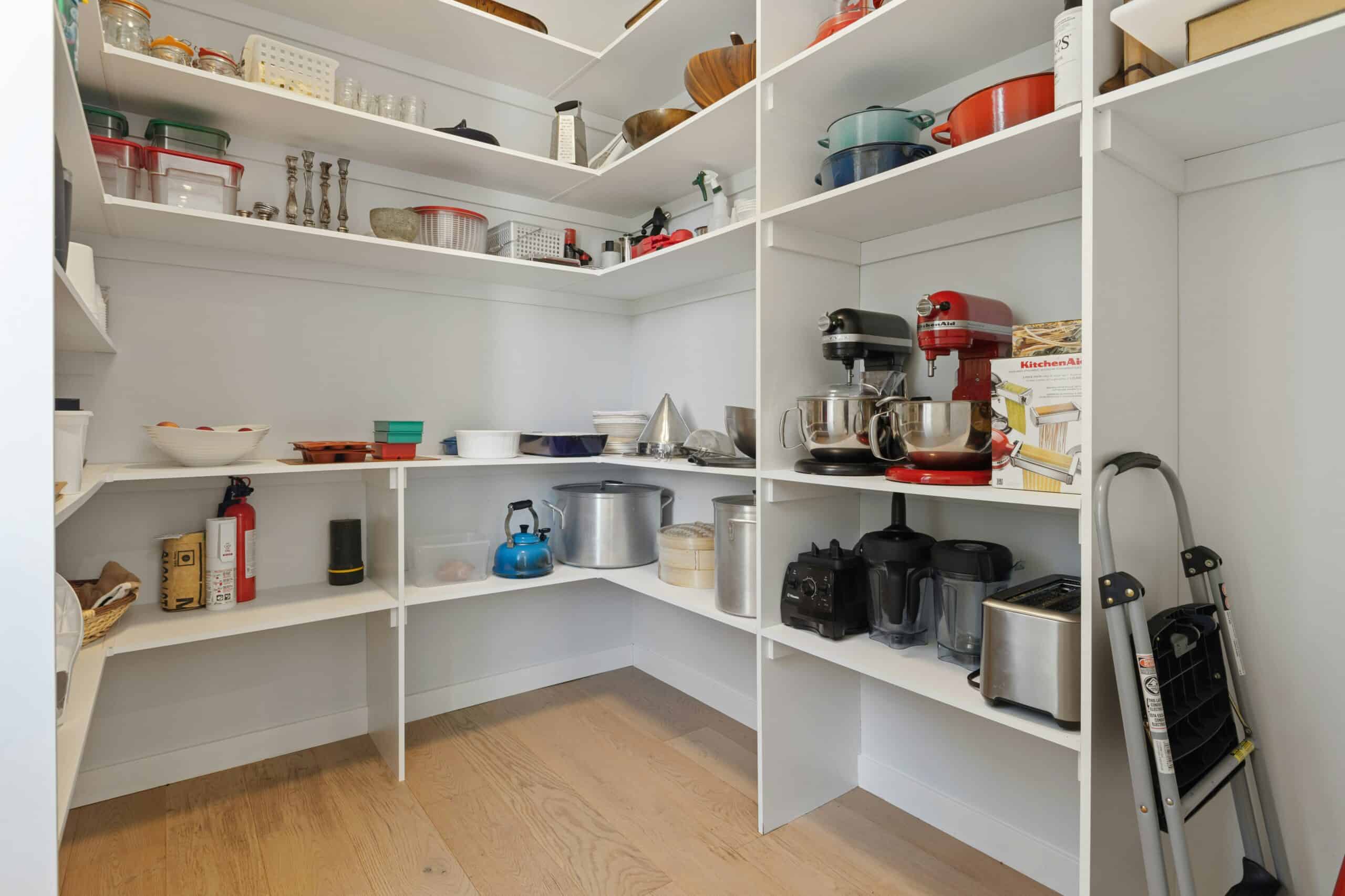 messy open kitchen shelves with clutter