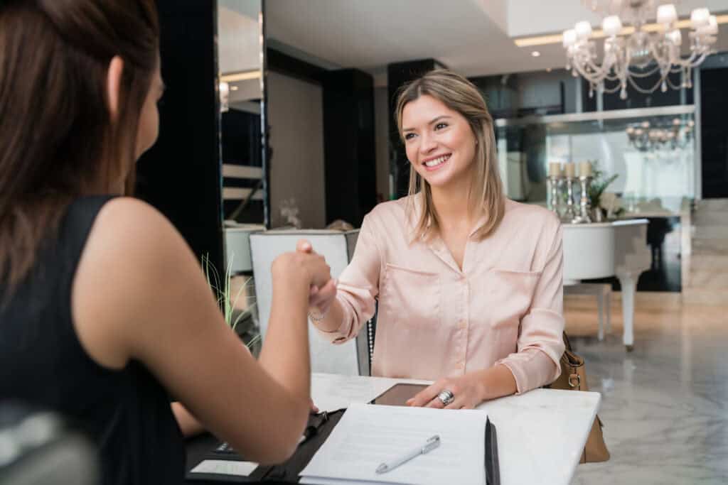 guest smiling at check in desk