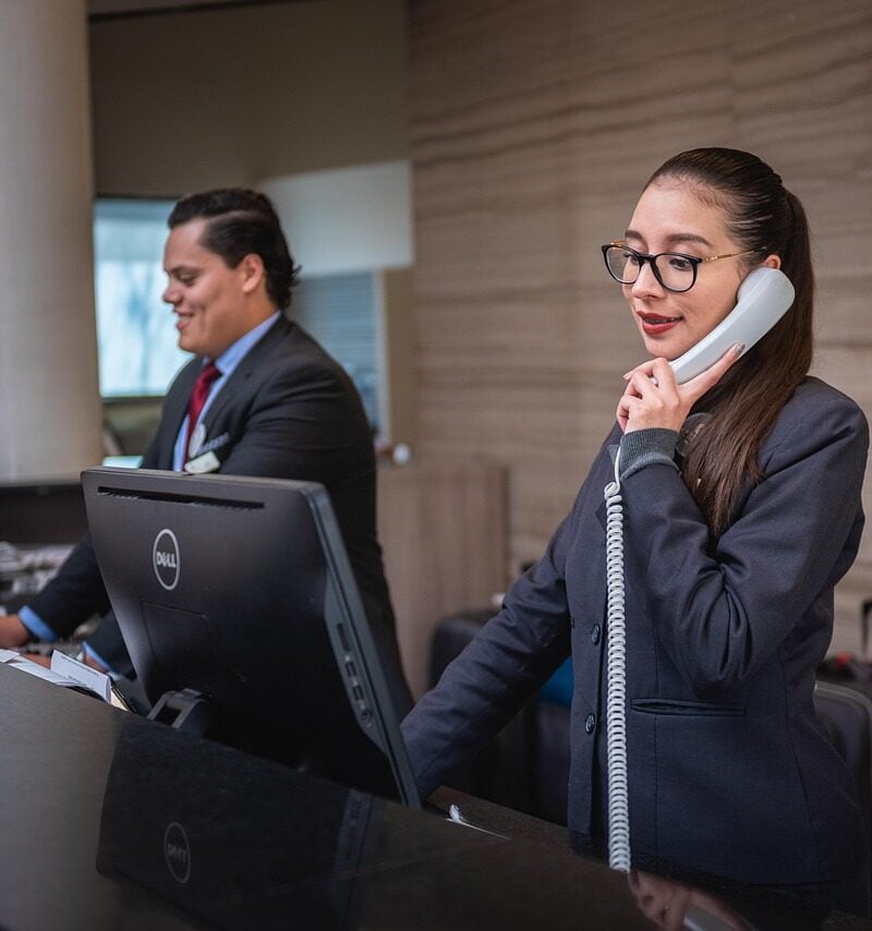 hotel lobby security desk modern interior guests walking