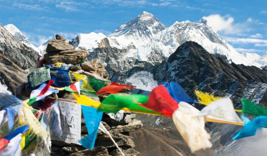 view of Mount Everest, Lhotse and Makalu with buddhist prayer flags from Gokyo Ri - Nepal