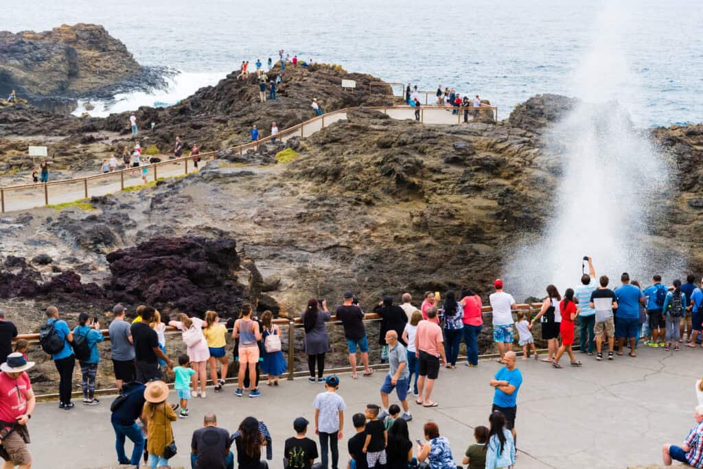 crowd on cliff edge selfie danger sea cliff fall risk