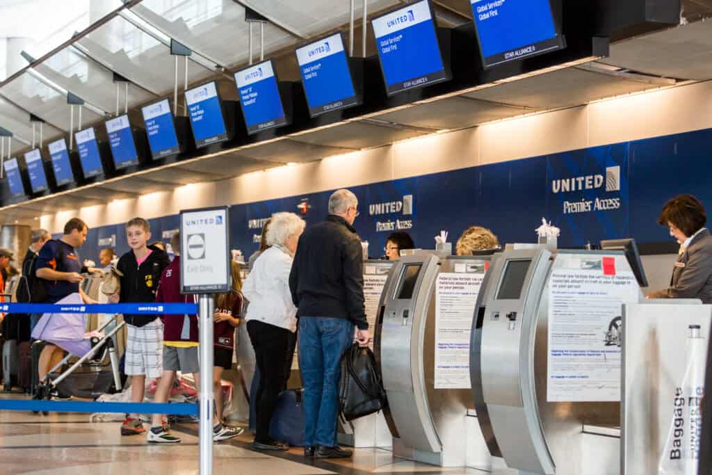 tourists at airport passport control USA