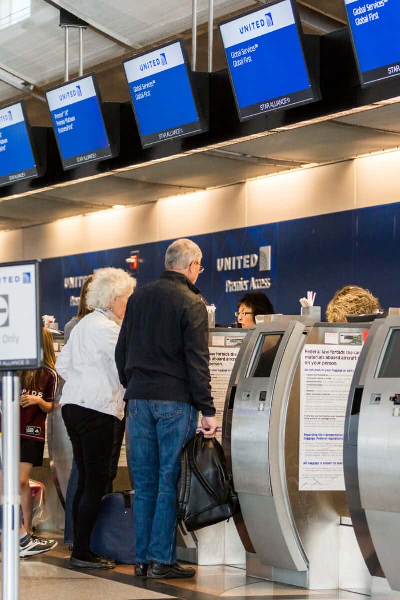 tourists at airport passport control USA