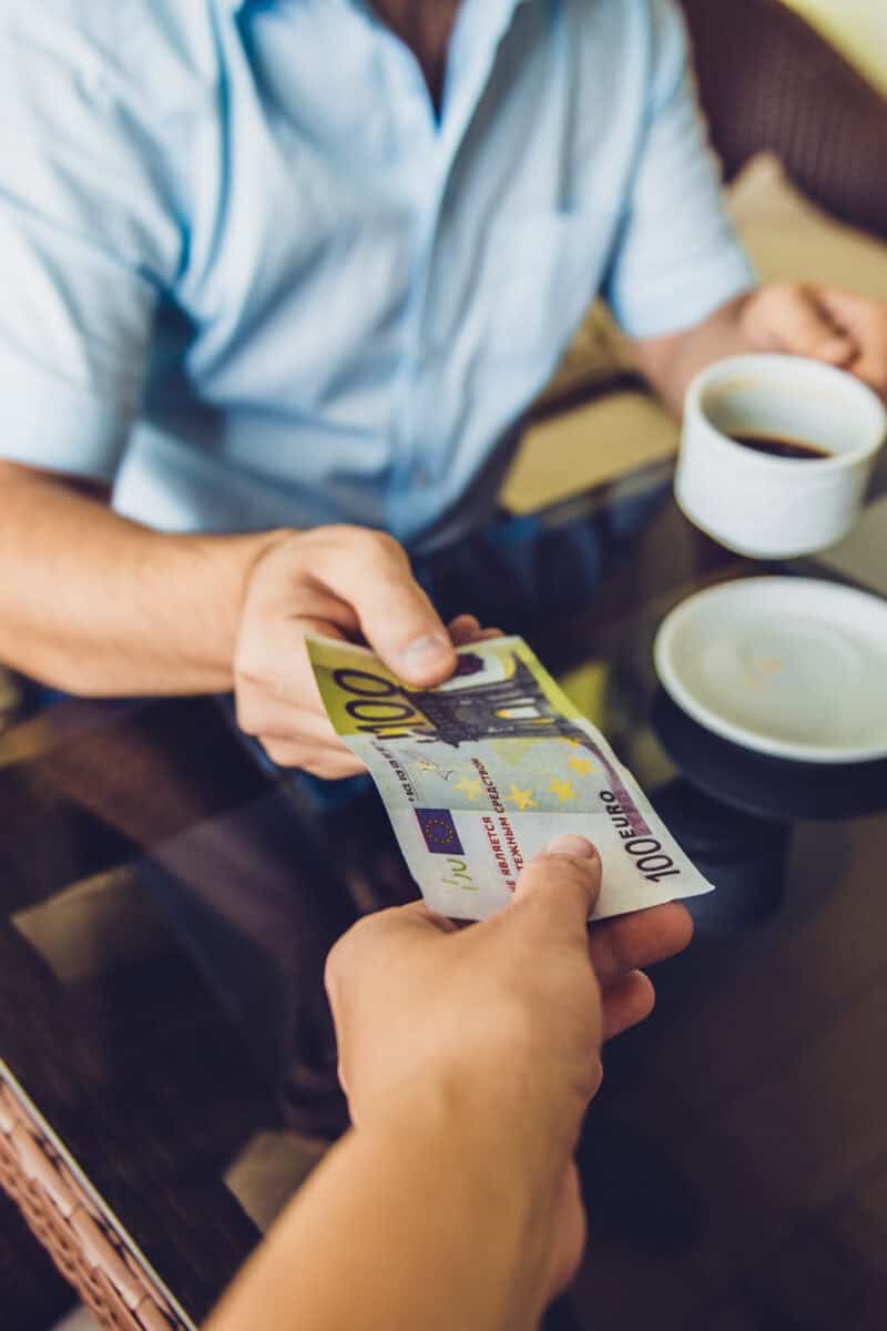 global tipping culture contrast restaurant bill tourist paying restaurant bill abroad card machine credit card terminal tip prompt travel dining restaurant bill close up tip section international