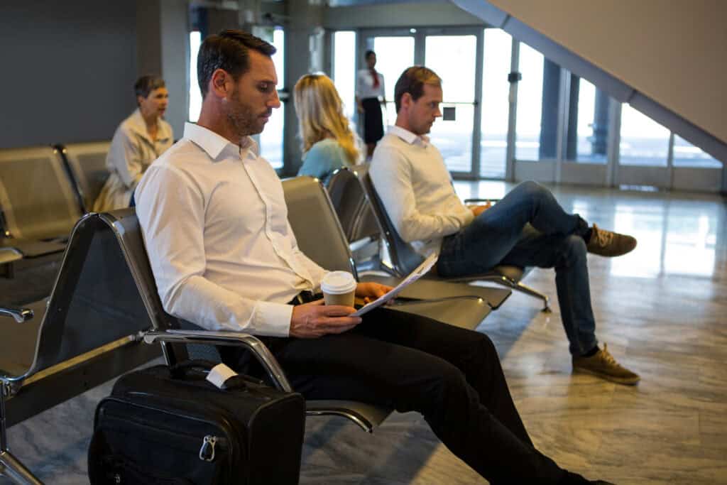 airport delay passengers sitting floor editorial