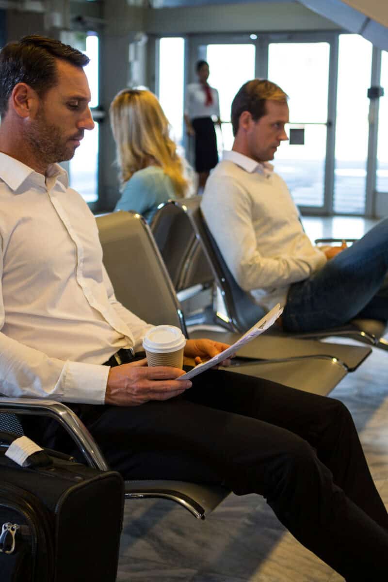 person logged into email on laptop airport