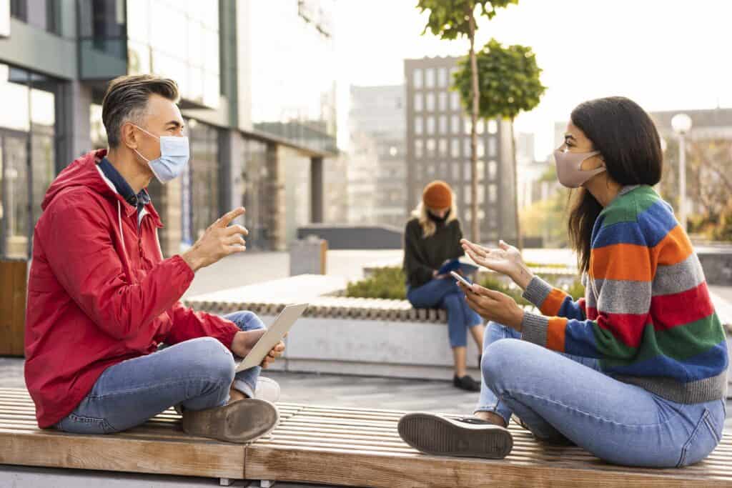 hostel communal area young travelers talking
