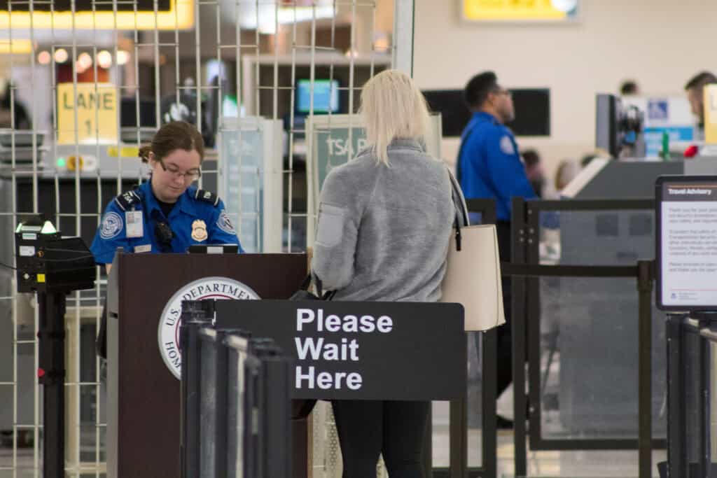 airport customs officer questioning traveler