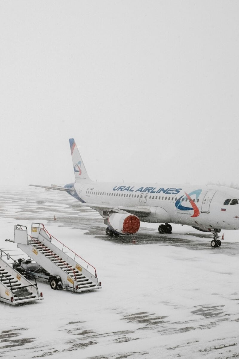 Winter storm airport cancellations departure board”