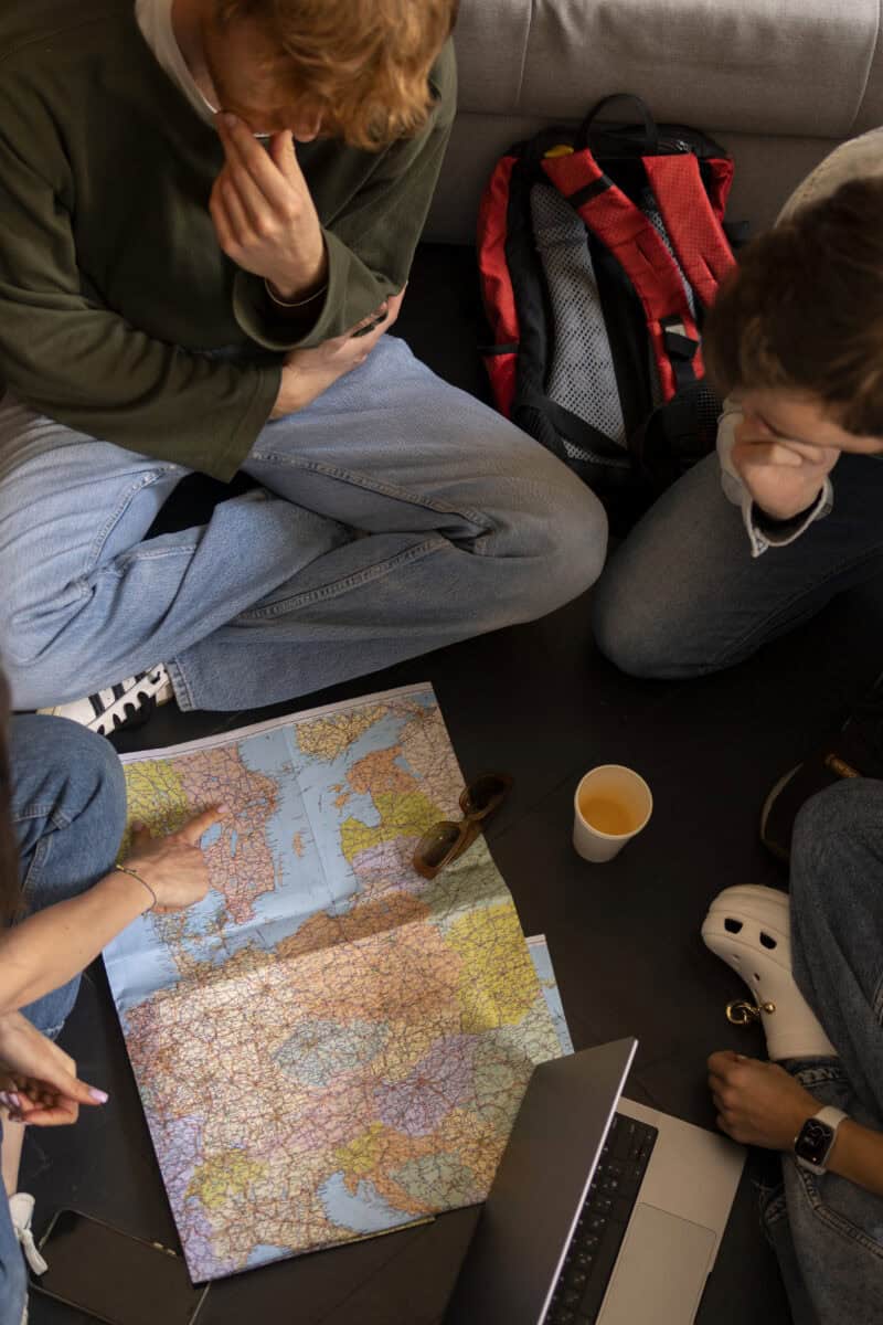 group discussion around table with map”