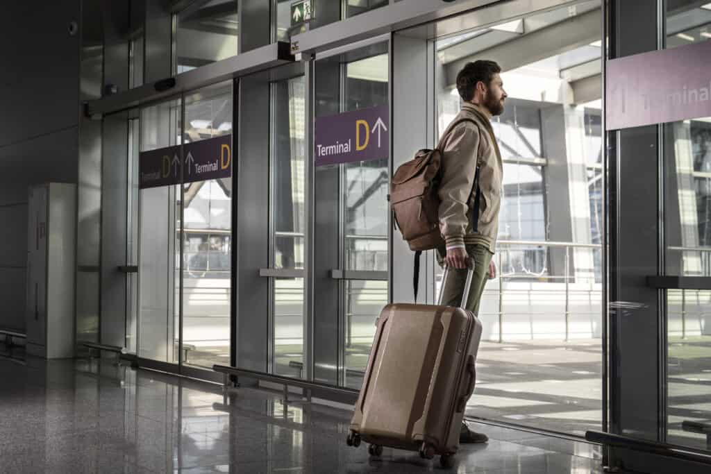 travelers waiting at airport gate