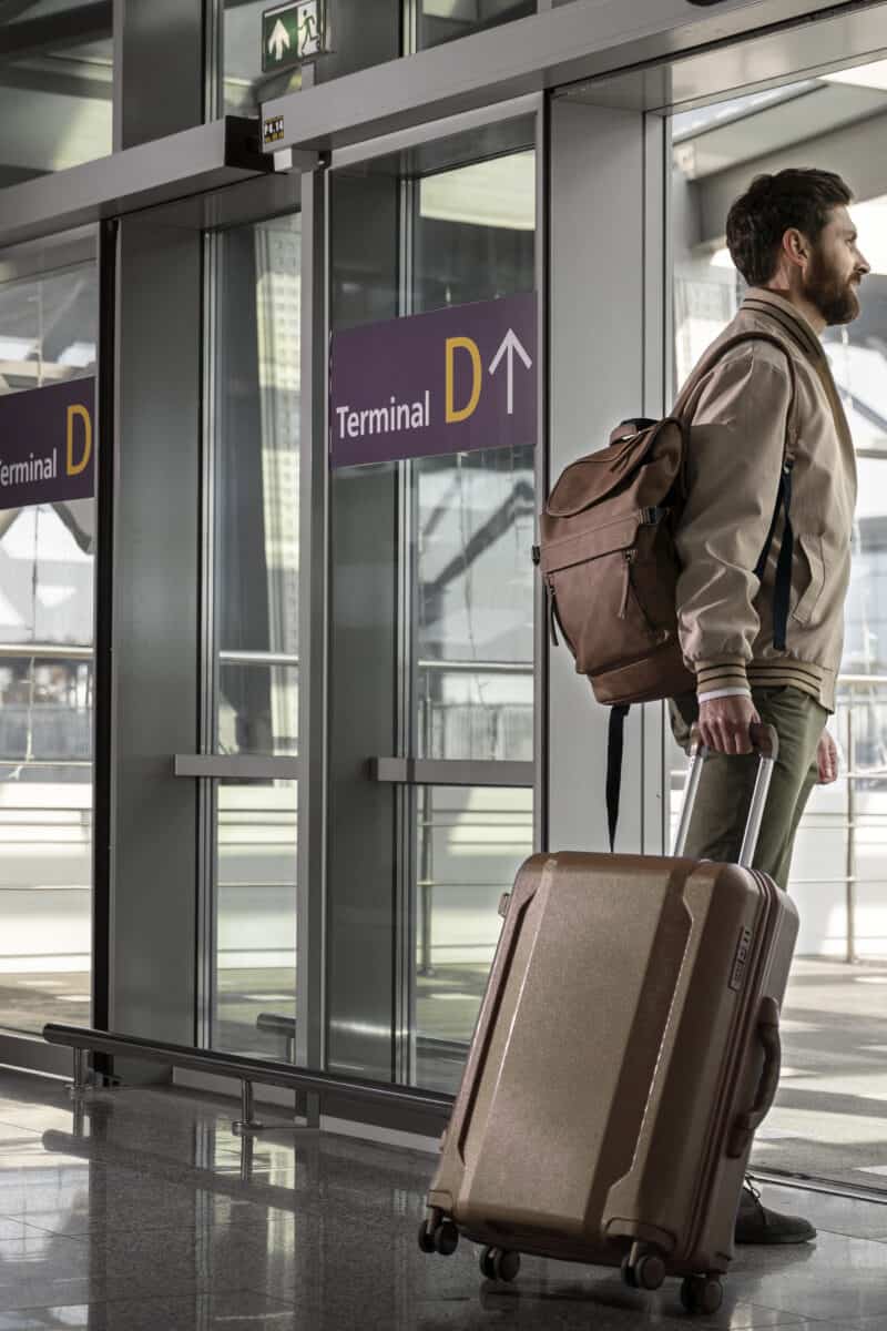 travelers waiting at airport gate