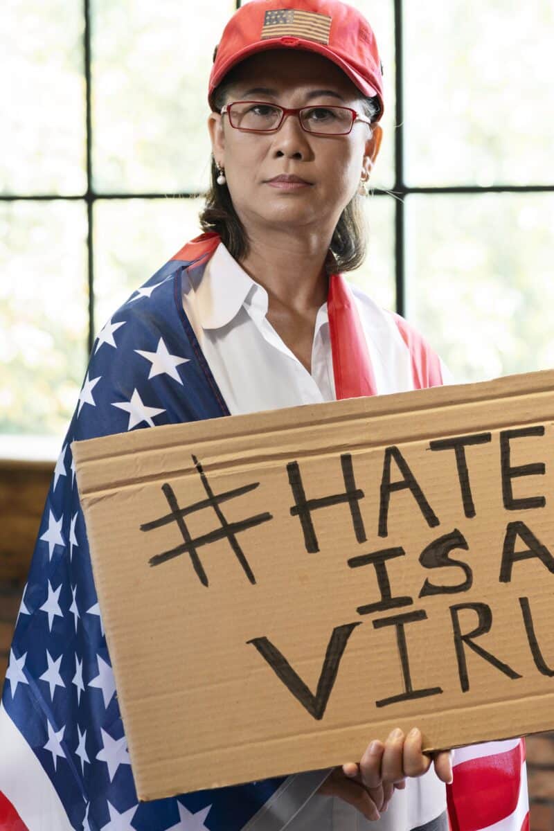 medium-shot-woman-with-american-flag-placard