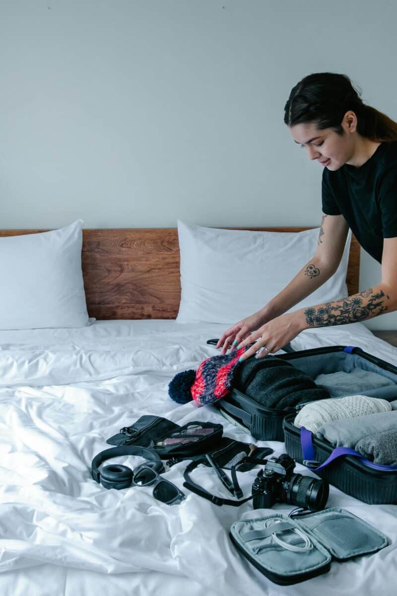 traveler packing backpack neatly