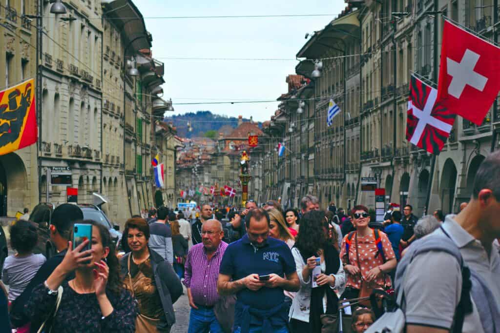 crowded European city street tourists