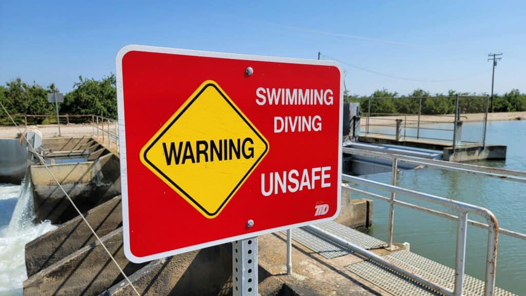 “no swimming sign beach”