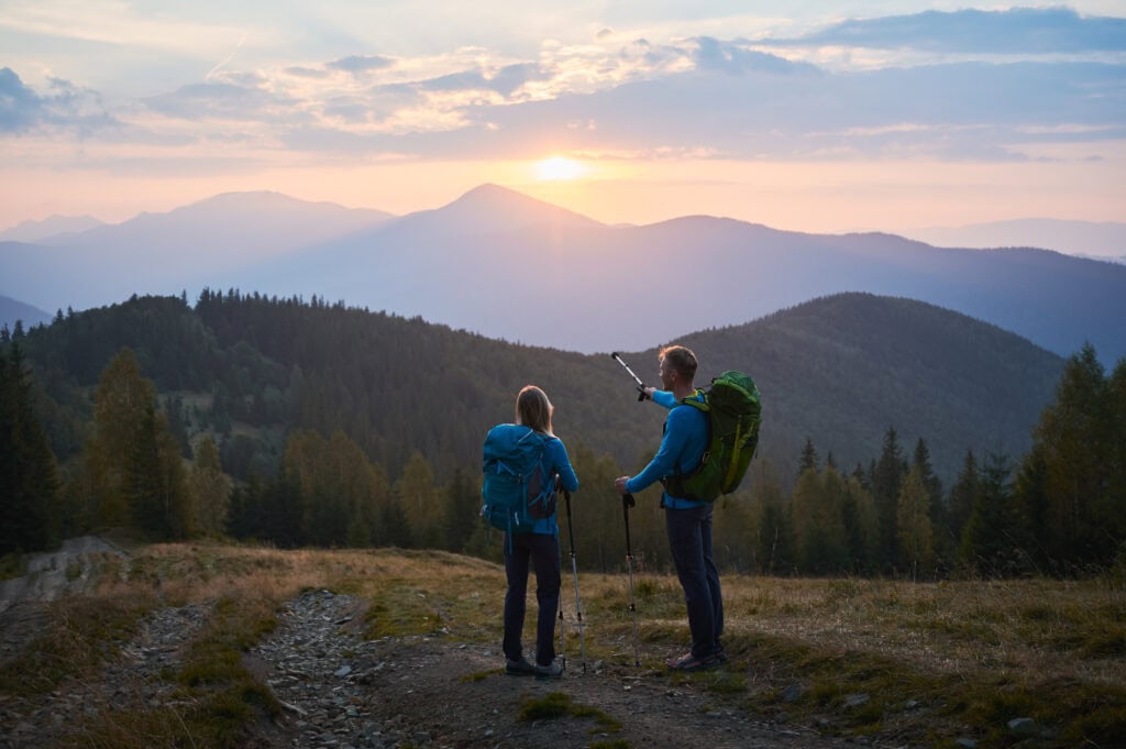 backpackers alpine trail sunrise
