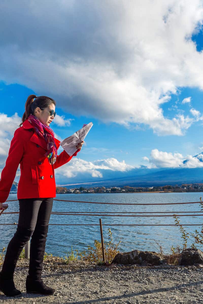 Tourist with baggage and map at Fuji mountain, Kawaguchiko in Ja