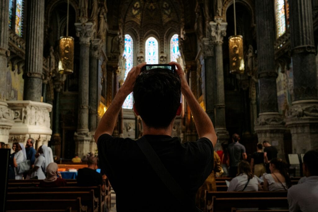“tourists taking photos church interior