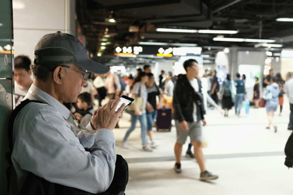 “tourists waiting long line tickets”