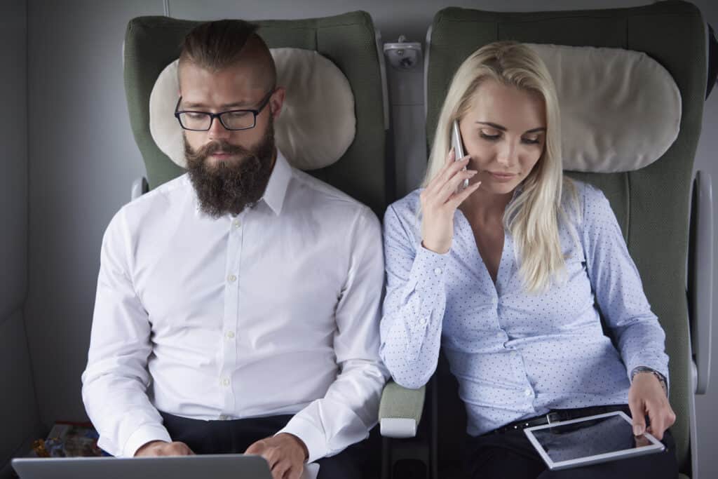 “airplane armrest etiquette middle seat”