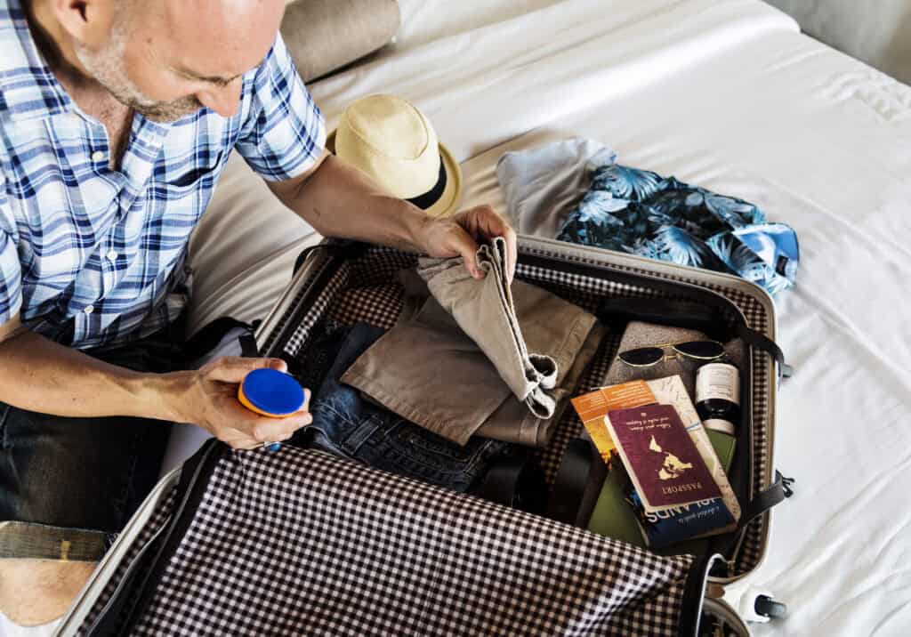 older traveler“overpacked suitcase traveler stairs”