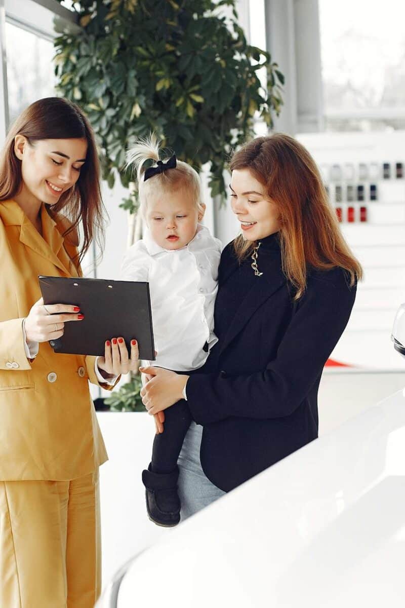 happy mother looking at contract