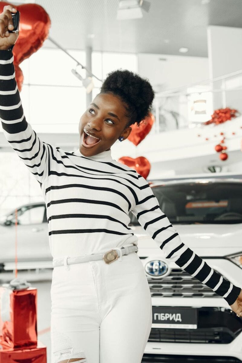 happy girl holding car keys