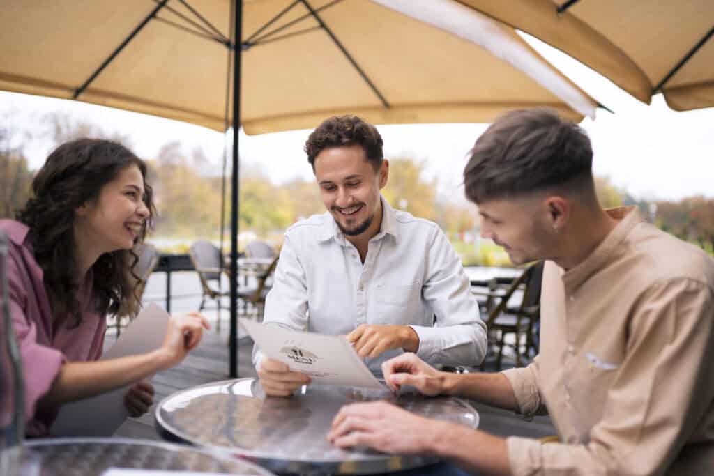 travelers debating at café table