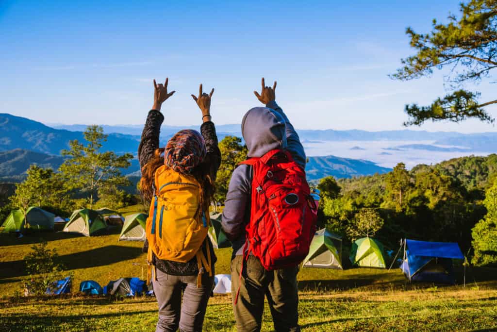 Young couple Backpacker Camping Hiking Journey Travel Trek Concept, Holiday travel, summer in Thailand.