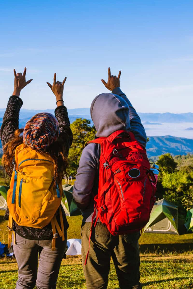 Young couple Backpacker Camping Hiking Journey Travel Trek Concept, Holiday travel, summer in Thailand.