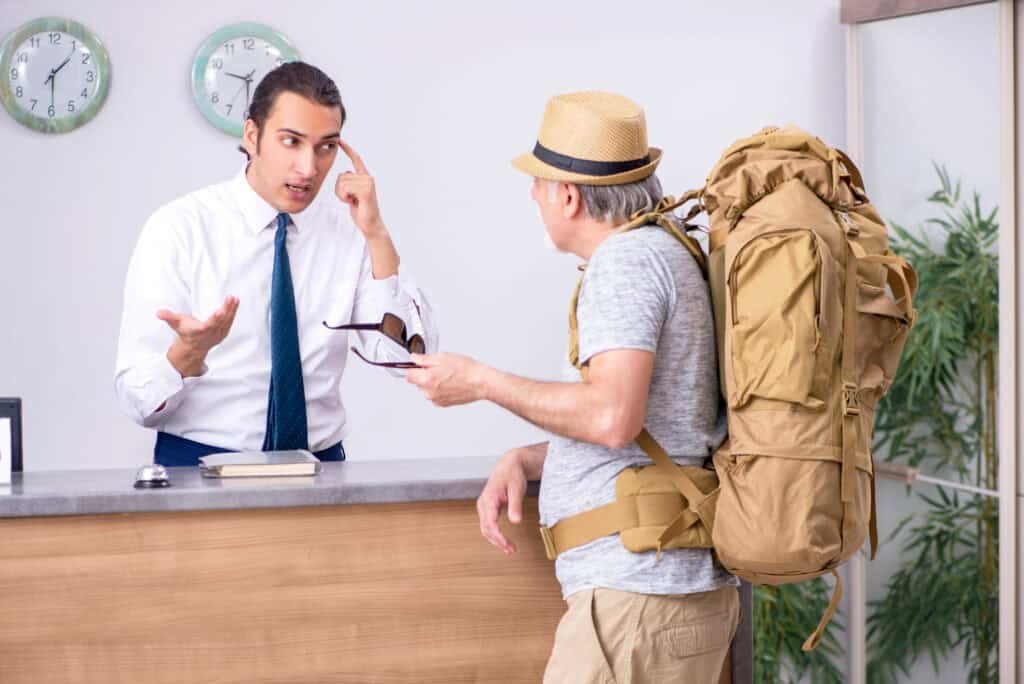 Backpacker at the hotel reception