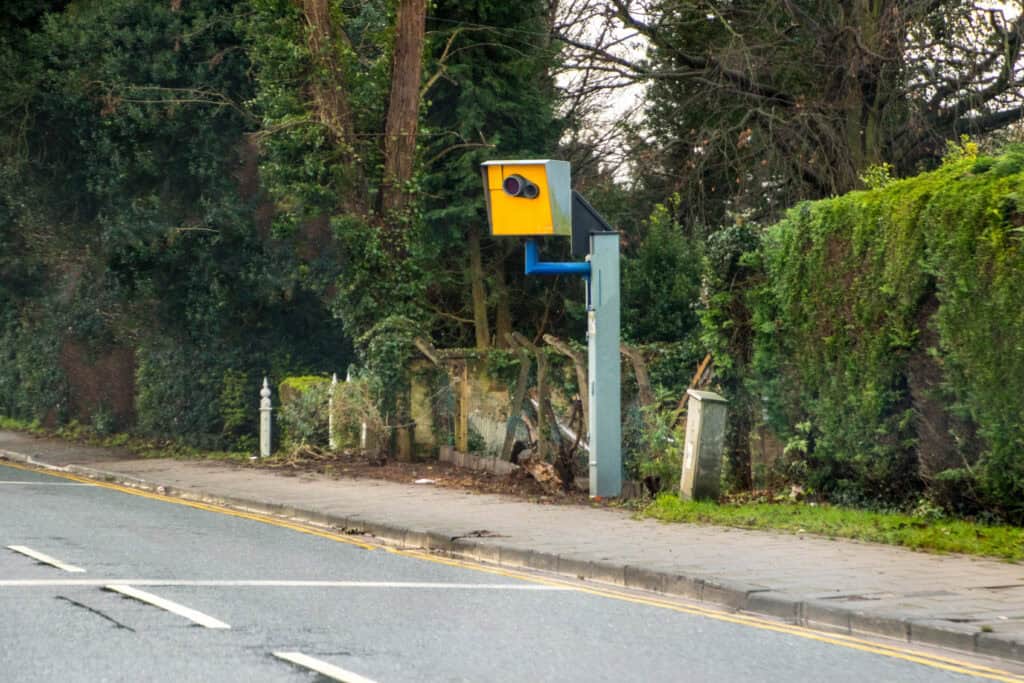 roadside speed camera flashing car