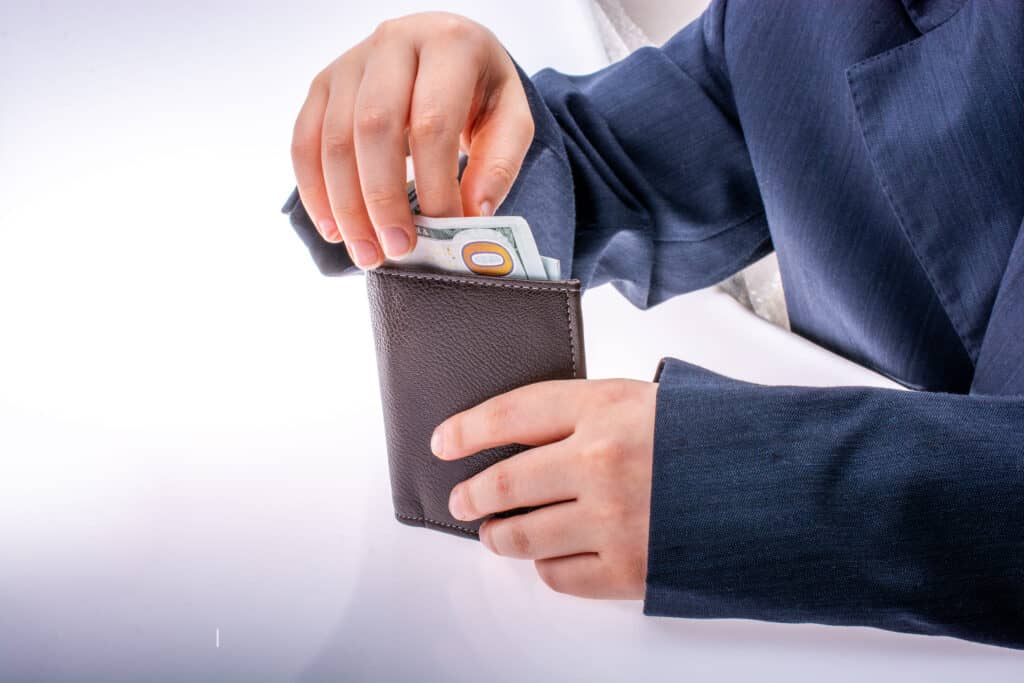 In A Separate Pocket Or Money Pouch