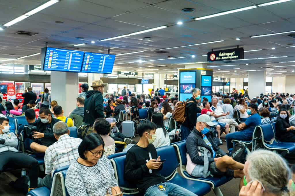airport cancelled flights crowd terminal chaos