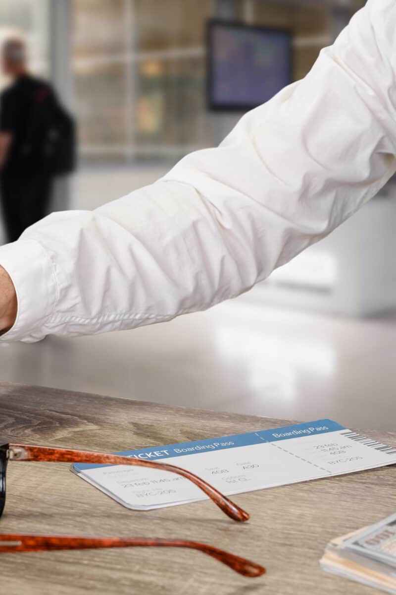 Closeup photo of young businessman waiting for flight check in