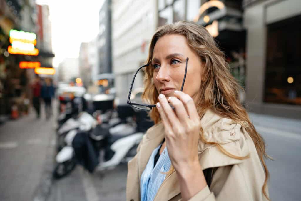 traveler observing foreign city street thoughtful