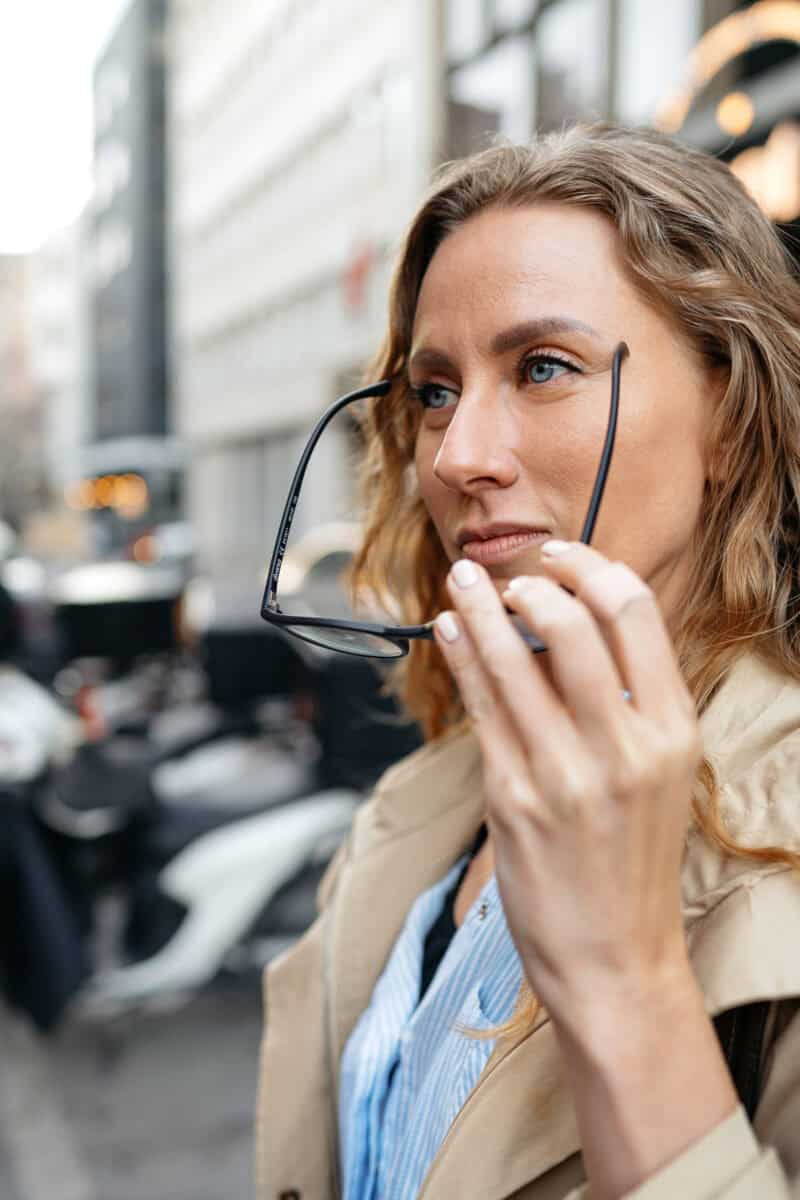traveler observing foreign city street thoughtful