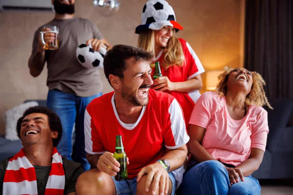 diverse football fans celebrating crowd